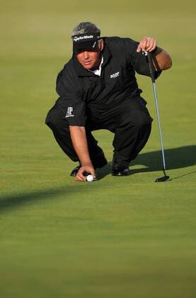 Golf - The Open 2011 - Royal St George s - Day 3 Darren Clarke (NI) lines up his putt on the 18th green to finish his third round in the lead at 5 under, at Royal St George s, Sandwich 