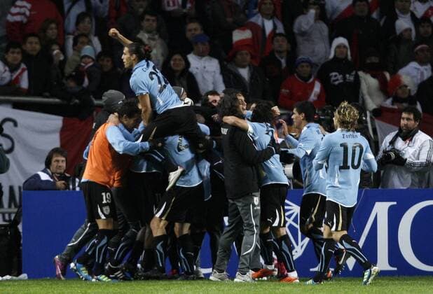 Uruguayan players celebrate during the semifinal match of Copa America between Uruguay and Peru in La Plata, Argentina, July 19, 2011. (Xinhua Martin Zabala) ARGENTINA-LA PLATA-SOCCER-COPA AMERICA-SEMI-FINAL-URUGUAY VS PERU 