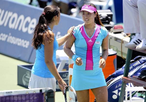 29 JULY 2011: Ayumi Morita (JPN) is patted on the shoulde by Marion Bartoli (FRA) after injuring her right foot during the WTA Tennis Damen Bank of the West Classic at Taube Family Tennis Center in Stanford, California TENNIS: JUL 29 Bank of The West Classic Icon110729025 EDITORIAL USE ONLY