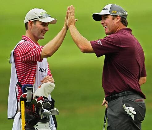 Aug. 4, 2011 - Akron, OH, USA - D.A. Points, right, high-fives his caddie, Matt Hall, after chipping in for a birdie out of a sand trap at the 6th green during the opening round at the 2011 WGC-Bridgestone Invitational at Firestone Country Club on Thursday, August 4, 2011, in Akron, Ohio. GLF-BRIDGESTONE - ZUMAm67