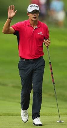 Aug. 4, 2011 - Akron, OH, USA - Adam Scott acknowledges the cheers from the gallery after sinking a birdie putt on the 17th hole during the opening round at the 2011 WGC-Bridgestone Invitational at Firestone Country Club on Thursday, August 4, 2011, in Akron, Ohio. Scott carried a one-stroke lead into the clubhouse after an 8-under round of 62. GLF-BRIDGESTONE - ZUMAm67