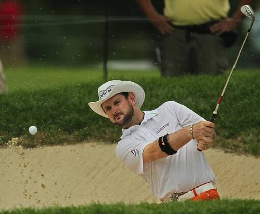 Aug. 4, 2011 - Akron, OH, USA - Rory Sabbatini hits out of a bunker on the 7th hole during the opening round at the 2011 WGC-Bridgestone Invitational at Firestone Country Club on Thursday, August 4, 2011, in Akron, Ohio. GLF-BRIDGESTONE - ZUMAm67