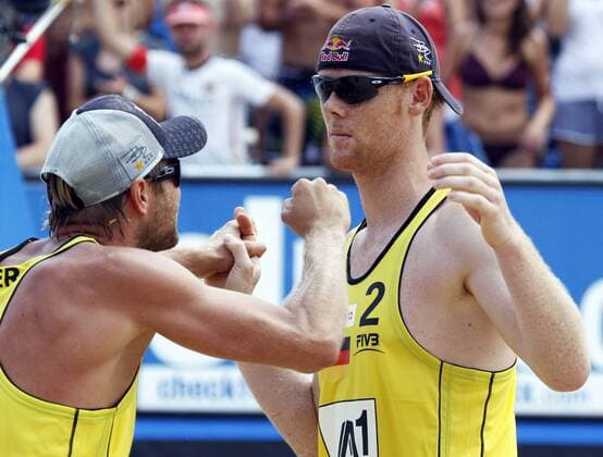 BEACHVOLLEYBALL - FIVB Grand Slam KLAGENFURT,AUSTRIA,07.AUG.11 - BEACH VOLLEYBALL - World Tour 2011, FIVB Grand Slam Klagenfurt, Halbfinale, Herren. Bild zeigt den Jubel von Julius Brink und Jonas Reckermann (GER). 
