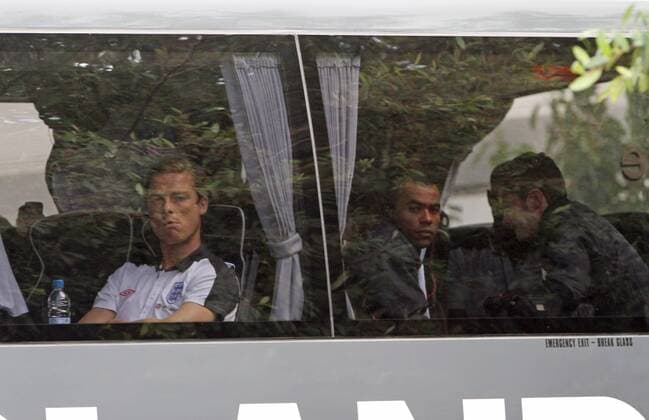 Englands Scott Parker and Ashley Cole look on from the coach Training - England 9th August, 2011 EDITORIAL USE ONLY. No use with unauthorised audio, video, data, fixture lists, club league logos or live services. Online in-match use limited to 120 images, no video emulation. No use in betting, games or single club league player publications.