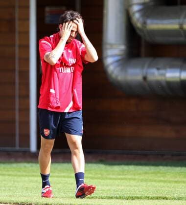 Arsenals Cesc Fabregas looks on dejected as he comes out for training - England 9th August, 2011 EDITORIAL USE ONLY. No use with unauthorised audio, video, data, fixture lists, club league logos or live services. Online in-match use limited to 120 images, no video emulation. No use in betting, games or single club league player publications.