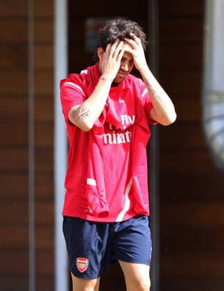 Arsenals Cesc Fabregas looks on dejected as he comes out for training - England 9th August, 2011 EDITORIAL USE ONLY. No use with unauthorised audio, video, data, fixture lists, club league logos or live services. Online in-match use limited to 120 images, no video emulation. No use in betting, games or single club league player publications.