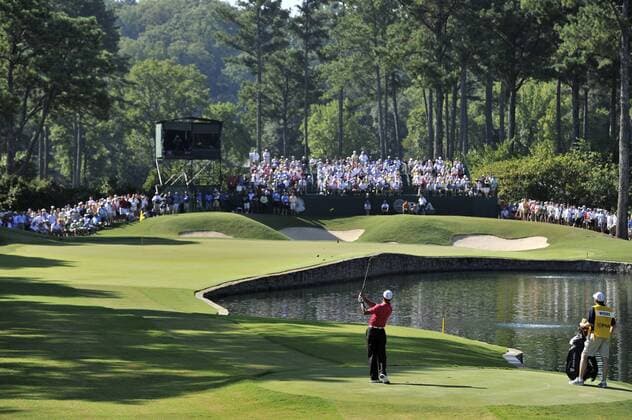 Tiger Woods hits from the drop zone on the 15th hole after putting his tee shot in the water during the first round of the 93rd PGA Golf Herren Championship at the Atlanta Athletic Club on August 11, 2011 in Johns Creek, Georgia.  BKX2011081127