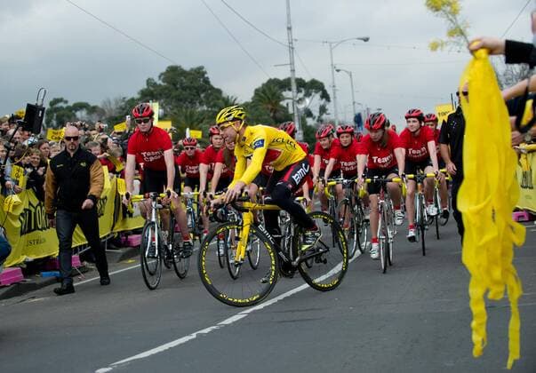 Riding in his winner s yellow jersey, Tour de France winner Cadel Evans of Australia is greeted by some of the thousands of fans which lined the streets for his homecoming victory parade in Melbourne, Australia - 