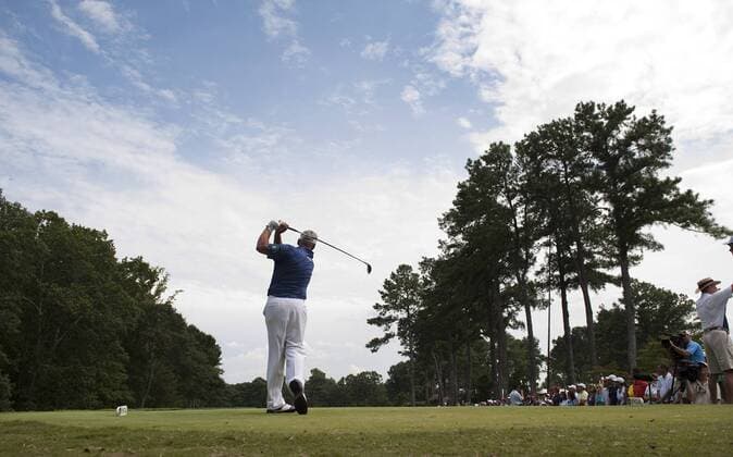 Golfer tees off on the 11th hole during the first round of the 93rd PGA Golf Herren Championship at the Atlanta Athletic Club on August 11, 2011 in Johns Creek, Georgia.  BKX2011081179