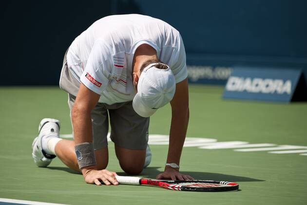 Aug. 12, 2011 - Montreal, Quebec, Canada - Mardy Fish (USA) falls while playing in QuarterFinal Round at the Uniprix stadium in Montreal, Quebec, Canada. ATP Tennis Herren Rogers Cup Tennis - August 2011 - Men QuarterFinal Round - ZUMAz70