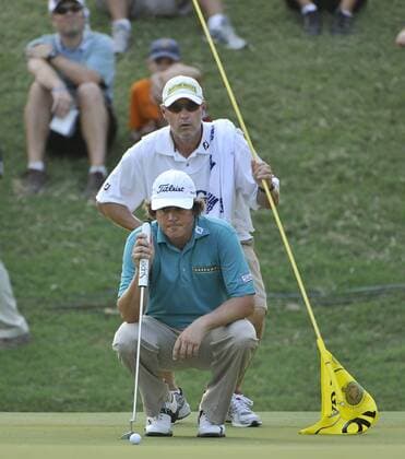 Jason Dufner (front) and his caddie Kevin Baile line up his putt on the 16th hole during the third round of the 93rd PGA Golf Herren Championship at the Atlanta Athletic Club on August 13, 2011 in Johns Creek, Georgia. After three rounds Dufner and Bendan Steele are tied for the lead at 7 under par.  BKX2011081351