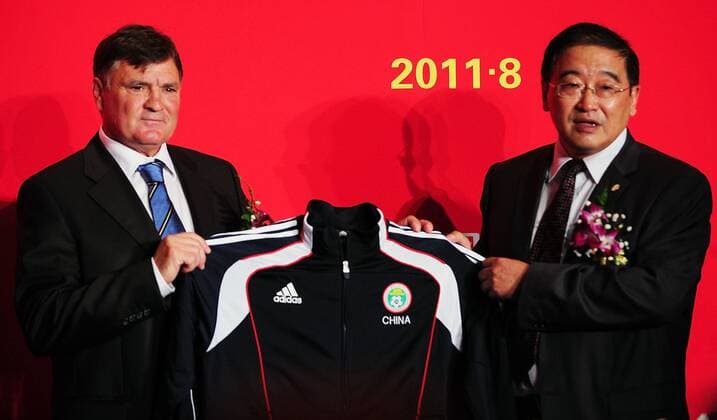 BEIJING, CHINA - AUGUST 14: (CHINA OUT) Jose Antonio Camacho, new head coach of China Men s Football Team poses with Wei Di(R), general secretary of the Chinese Football Association, during a press conference after signing for Chinese Football Association at the Sofitel Hotel on Augsut 14, 2011 in Beijing, China.  CFP20135995 