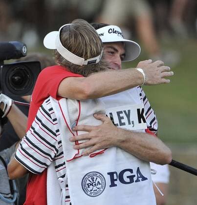Keegan Bradley (R) hugs his caddie Steven Hale after winning the 93rd PGA Golf Herren Championship at the Atlanta Athletic Club on August 14, 2011 in Johns Creek, Georgia. Bradley defeated Jason Dufner in a three-hole playoff to win the tournament by one stroke.  BKX2011081426
