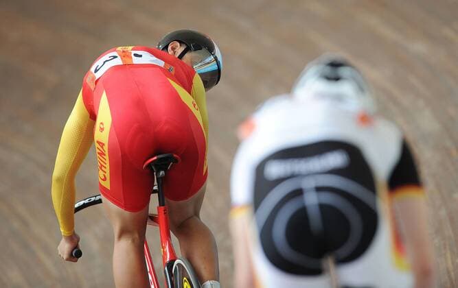 Zhang Miao of China reacts during men s sprint of cycling track at the 26th Summer Universiade in Shenzhen, a city of south China s Guangdong Province, on Aug. 18, 2011. Zhang got the bronze medal in the match. (Xinhua Li Ga)(wx) CHINA-SHENZHEN-UNIVERSIADE-CYCLING TRACK-MEN S SPRINT (CN) 