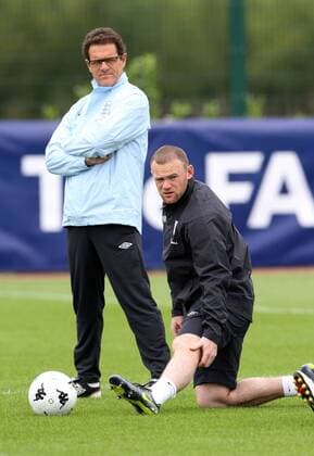 Englands Fabio Capello and Wayne Rooney during training Training Training - England 30th August, 2011 EDITORIAL USE ONLY. No use with unauthorised audio, video, data, fixture lists, club league logos or live services. Online in-match use limited to 120 images, no video emulation. No use in betting, games or single club league player publications.