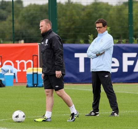 Englands Wayne Rooney is watched by Fabio Capello during training Training Training - England 30th August, 2011 EDITORIAL USE ONLY. No use with unauthorised audio, video, data, fixture lists, club league logos or live services. Online in-match use limited to 120 images, no video emulation. No use in betting, games or single club league player publications.