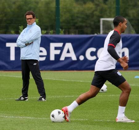 Englands Theo Walcott is watched by Fabio Capello during training Training Training - England 30th August, 2011 EDITORIAL USE ONLY. No use with unauthorised audio, video, data, fixture lists, club league logos or live services. Online in-match use limited to 120 images, no video emulation. No use in betting, games or single club league player publications.