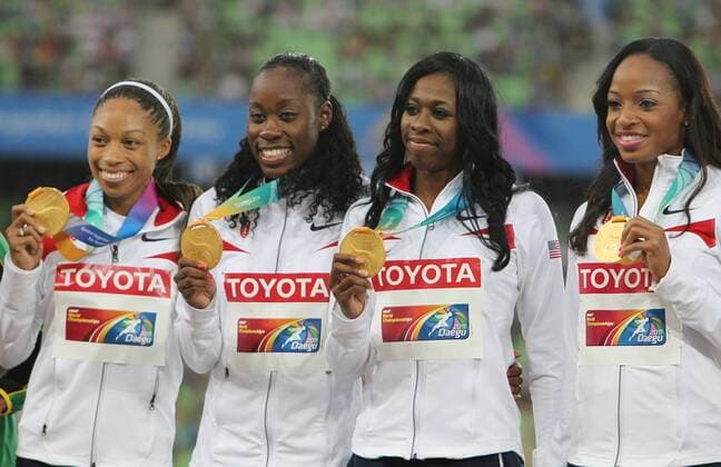 DAEGU, Sept. 4, 2011 -- Gold medalists Sanya Richards Ross, Allyson Felix, Jessica Beard and Francena McCorory of the USA pose on the podium during the awarding ceremony for the women s 4x400 meters relay event at the IAAF World Championships in Daegu - 