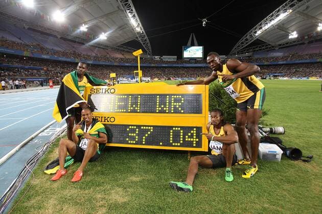 DAEGU, Sept. 4, 2011 -- (L-R) Jamaica s Nesta Carter, Michael Frater, Yohan Blake and Usain Bolt pose by the stop clock with their new world record time of 37.04 after winning the men s 4x100 metres relay final at the IAAF World Athletics Championships in Daegu, South Korea, September 4, 2011. 