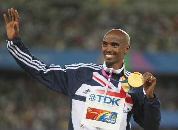 DAEGU, Sept. 4, 2011 -- Mohamed Mo Farah of Britain reacts during the awarding ceremony for the men s 5,000 metres event at the IAAF World Athletics Championships in Daegu, South Korea, September 4, 2011. He claimed the title of the event in 13 minites and 23.36 seconds. 