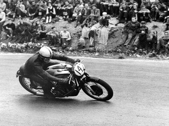 The winner once again and unbeaten at Brands Hatch in three years , John Surtees , winning on his Norton motorbike after beating Geoff Duke once again . 2 October 1955 UnitedArchives1246731