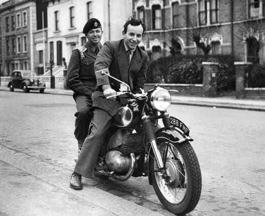 John Surtees , international motor cyclist from Forest Hill , London , was approached by men of the Royal Engineers today and asked for a ride on his pillion . This was part of their initiative test for selection for NCO. John Surtees is pictured with Sapper M Hume on pillion . 8 April 1956 UnitedArchives1246738
