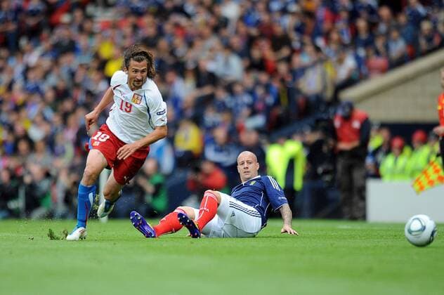 Football - Euro 2012 Qualifier - Scotland vs. Czech Republic Jan Lastuvka (Czech Republic) gets past Alan Hutton (Scotland) at Hampden Park 
