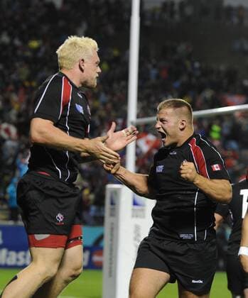 Rugby Union - Rugby World Cup 2011 -Tonga v Canada Phil MacKenzie - Canada celebrates his winning try with Jason Marshall (right). 