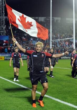 Rugby Union - Rugby World Cup 2011 - Dth Van der Merwe - Canada celebrates their victory after the game with the Canadian Flag.  o0 Fahne, Landesfahne Objekte