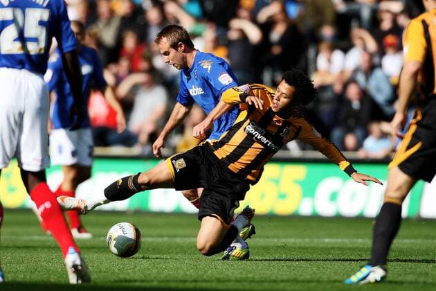 npower Championship - Hull City vs. Portsmouth FC - at The KC Stadium Hull s Liam Rosenior battles with Portsmouth s Luke Varney 17 09 2011 