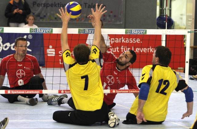 Leverkusen s Barbaros Sayilir (R) attacks during the final match of the German Sitting Volleyball between TSV Bayer 04 Leverkusen and Leipzig, Fritz-Jacobi-Anlage in Leverkusen on September 18., 2011. Deutsche Meisterschaften im Sitzvolleyball in Leverkusen am 18. September 2011.