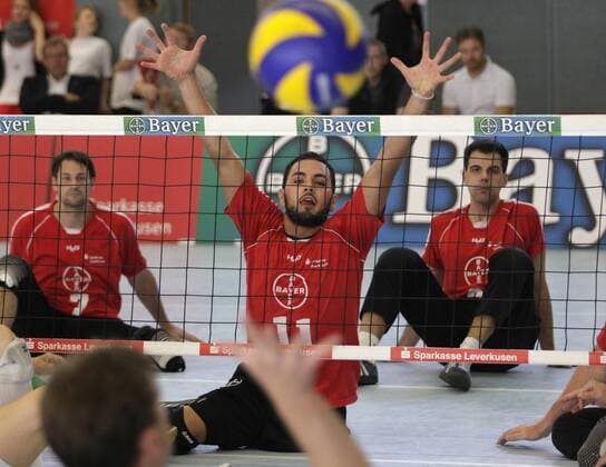 Leverkusen s Barbaros Sayilir (R) looks on during the final match of the German Sitting Volleyball between TSV Bayer 04 Leverkusen and Leipzig, Fritz-Jacobi-Anlage in Leverkusen on September 18., 2011. Deutsche Meisterschaften im Sitzvolleyball in Leverkusen am 18. September 2011.