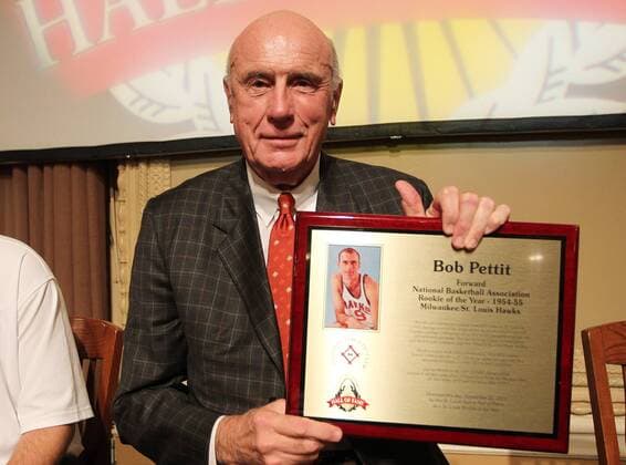 Former St. Louis Basketball Hawks Bob Pettit displays his award during the St. Louis Sports Hall of Fame Rookie of the Year event in St. Louis on September 22, 2011. Rookies of the Year in various sports were honored by the Hall of Fame.  SLP2011092225
