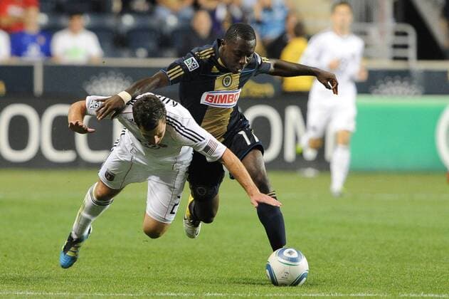 Sept. 29, 2011 - Chester, Pennsylvania, U.S - Philadelphia Union midfielder Freddy Adu (11) with the ball being defended by D.C. United defender Perry Kitchen (23). In a game is being being played at PPL Park in Chester, Pennsylvania the Philadelphia Union defeated the D.C. United 3-2 MLS Fussball Herren USA 2011 - Sep 29 - D.C. United at Philadelphia Union - ZUMAx80