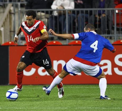 Dwayne De Rosario (L) of Canada drives the ball during the 2014 World Cup CONCACAF qualification match against Puerto Rico in Toronto, Canada, on Oct. 11,2011. The match ended with a 0-0 draw.(Xinhua Zou Zheng)(ql) CANADA-TORONTO-2014 WORLD CUP CONCACAF QUALIFICATION MATCH-CANADA VS PUERTO RICO 