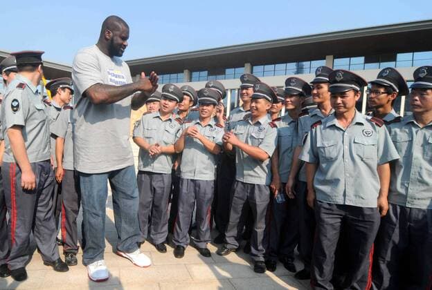 Former NBA Basketball Herren USA superstar Shaquille ONeal reacts to Chinese security guards at a promotional event by Chinese sportswear brand Li-Ning during his China tour in Nanning city, south Chinas Guangxi Zhuang Autonomous Region, 19 October 2011. Shaquille ONeal heats up Nanning on China tour  pau556073_07