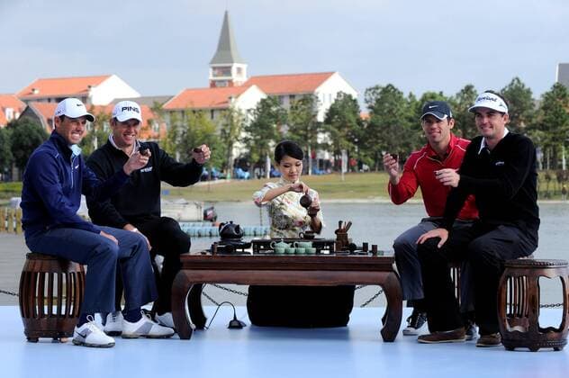 (From left) Golfers Charl Schwartzel of South Africa, Lee Westwood of Britain, Paul Casey of Britain and Keegan Bradley of the United States attend a traditional Chinese tea ceremony during a press conference for the forthcoming Lake Malaren Shanghai Masters golf tournament in Shanghai, China, 25 October 2011.  20111025_39004