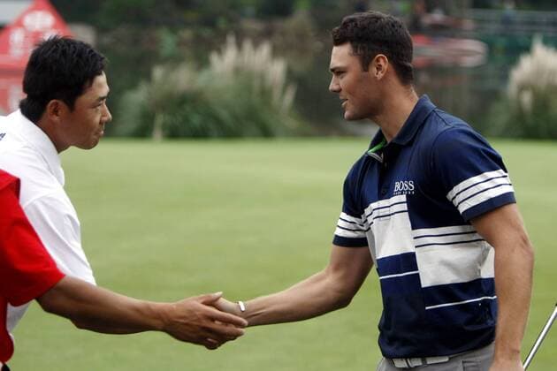 Martin Kaymer of Germany shakes hands with other golfers after winning the 2011 WGC-HSBC Champions golf tournament at the Sheshan International Golf Club in Shanghai  20111106_95414