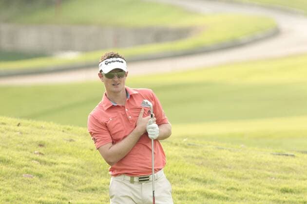 10.11.2011. Singapore. Justin Rose(ENG) observes his approach shot from the fairway of hole 15 Serapong Course during Round 1 of the Barclays Singapore Open 2011, Sentosa Golf Club. xDanielxSweex  ActionPlus11219702 Content restricted for UK based newspaper