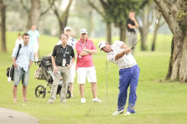 10.11.2011. Singapore. Graeme McDowell(NIR) makes his approach shot from the edge of the rough on hole 18 Serapong Course during Round 1 of the Barclays Singapore Open 2011, Sentosa Golf Club. xDanielxSweex  ActionPlus11219708 Content restricted for UK based newspaper