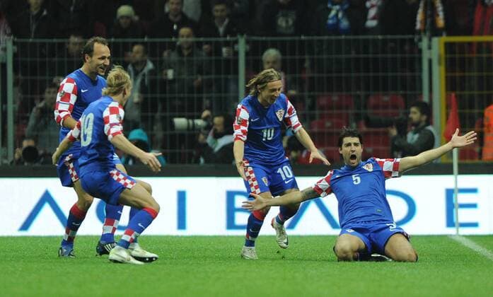 UEFA Euro 2012 play off first leg match between Turkey and Croatia ( blue)at Turk Telekom Arena Stadium in Istanbul, Turkey 11.11.2011 Match scored: Turkey 0 - Croatia 3 Pictured: Vedran Corluka and Luka Modric of Croatia. 