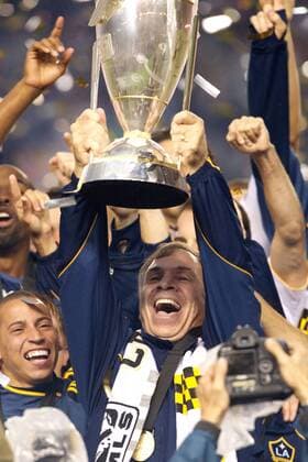 Nov. 20, 2011 - Carson, California, United States of America - Los Angeles Galaxy Head Coach Bruce Arena hoists the MLS Fussball Herren USA Cup in victory after the 2011 Major League Soccer Championship match between the Houston Dynamo and the Los Angeles Galaxy at the Home Depot Center in Carson, California. The Galaxy defeated the Dynamo 1-0 to capture their first MLS Fussball Herren USA title. MLS Fussball Herren USA CUP 2011 - Nov 20 - Dynamo at Galaxy - ZUMAq56