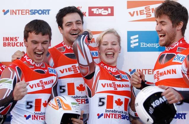 RODELN - FIL WC Igls INNSBRUCK,AUSTRIA,27.NOV.11 - DIVERS, RODELN - FIL Weltcup Igls, Kunstbahn, Siegerehrung. Bild zeigt den Jubel von Tristan Walker, Justin Snith, Alex Gough und Samuel Edney (CAN). 
