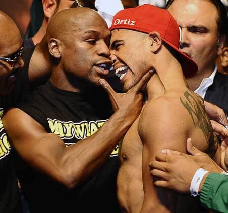 Sept. 16, 2011- Las Vegas, Nevada, U.S. - FLOYD MAYWEATHER JR. (L) gets in the face of his opponent, VICTOR ORTIZ at the weigh-in for their upcoming WBC welterweight title fight this Saturday night at the MGM Grand hotel. Boxing 2011 - Ortiz vs Mayweather Weigh-in - ZUMAbl1