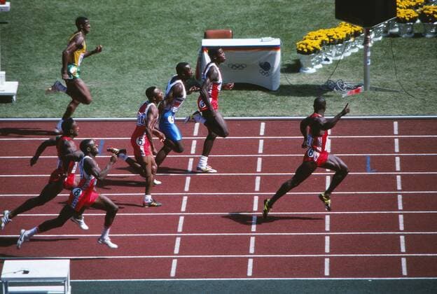 Athletics : Seoul Olympics 1988 Men s 100m Final. Ben Johnson (Canada) breaks away from Carl Lewis (USA) and Linford Christie (GBR) to win which was later taken away from him after proving positive in a drugs test. 24 09 1988 