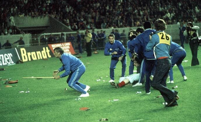 People take cover from missiles thrown by the Leeds United supporters. Leeds United v Bayern Munich, European Cup Final, Paris, 28 05 1975. 