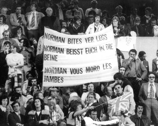 Leeds United fans with a banner, Norman bites yer legs (Norman Hunter). Leeds United, 28 05 75 European Cup Final at Parc de France Paris 1975. 