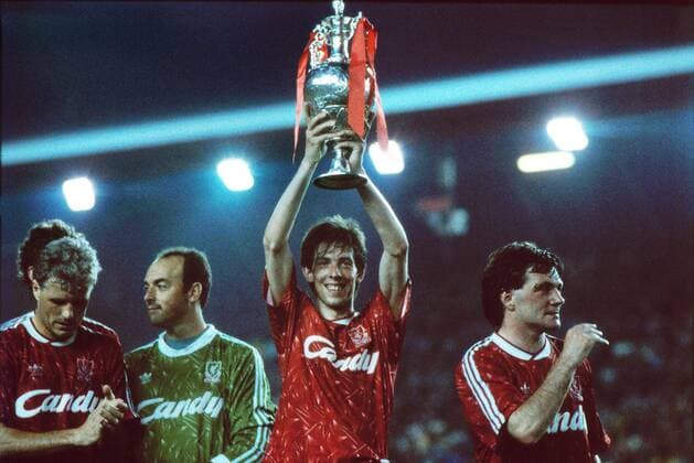 Gary Ablett (FC Liverpool) celebrate their League Championship title with the trophy. Ray Houghton (right) and Bruce Grobbelaar (left) FC Liverpool v Derby County 01 05 1990 