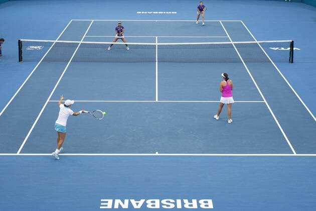 06.01.2012 Brisbane, Australia. Action from Womens Doubles Main Draw match played between Ashleigh Barty (AUS) Casey Dellacqua (AUS) and Raquel Kops-Jones (USA) Abigail Spears (AUS) played on Pat Rafter Arena. xCHRISxTIPPELTx-xSTAFFx  ActionPlus11230874