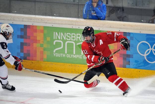 OLYMPIA - YOG 2012, CAN vs USA INNSBRUCK,AUSTRIA,15.JAN.12 - DIVERS, OLYMPIA, EISHOCKEY- YOG2012, Olympische Jugend-Winterspiele Innsbruck, Kanada vs Vereinigte Staaten von Amerika. Bild zeigt Eric Cornel (CAN) und Adam Baughman (USA). 